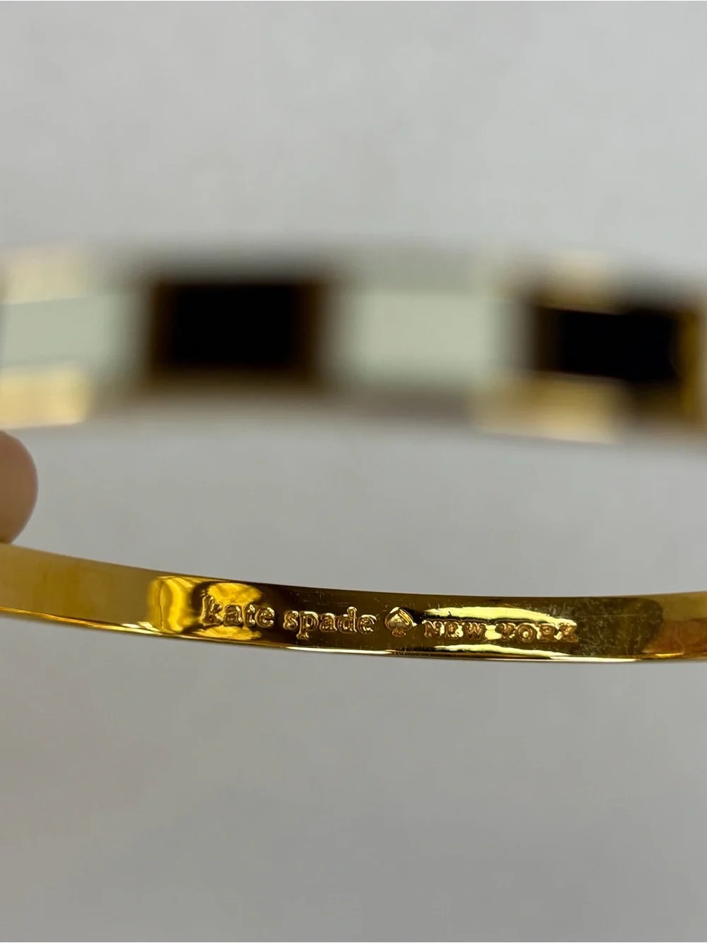 Kate-Spade gold-tone black and white enamel bracelet - Picture 2 of 3